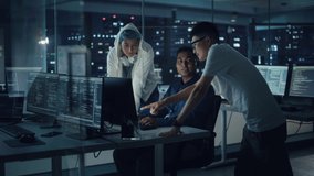 Diverse Team of Professionals Meeting in Office at Night: Brainstorming IT Programmers Use Computer Together, Talk Strategy, Discuss Planning. Software Engineers Develop Inspirational App Program - Powered by Shutterstock - Get 15% off with code: PIKWIZARD15