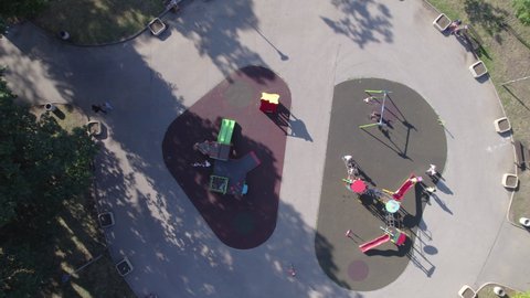 child playing in city park aerial view