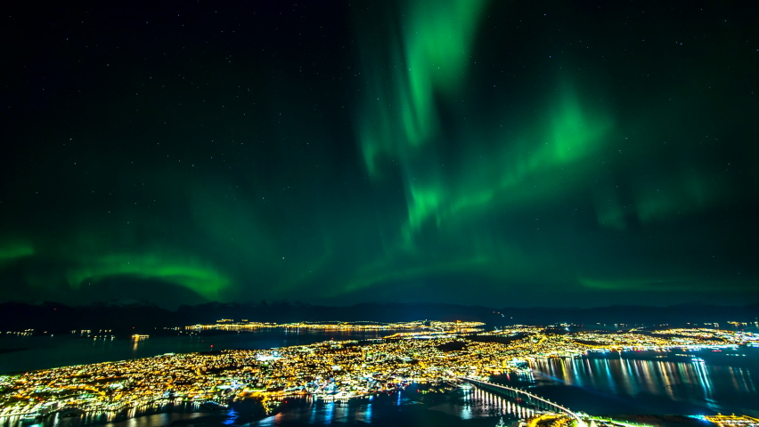 Northern Lights over Tromso city, Norway - time-lapse from Fjellheisen viewpoint Royalty-Free Stock Footage #1078715051
