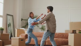 Home owners. Happy man hugging and lifting wife, laughing together, celebrating moving day in their new apartment, feeling excited moving into own house, slow motion - Powered by Shutterstock - Get 15% off with code: PIKWIZARD15