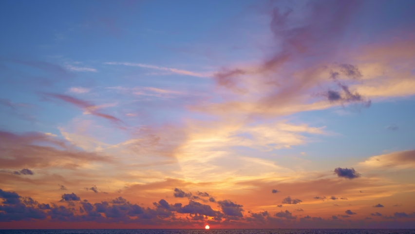 Time lapse Amazing colorful Majestic sunset landscape Beautiful light of nature cloudscape sky and Clouds moving away rolling 4k Dramatic sunset clouds Footage timelapse Fantastic natural sunset sea