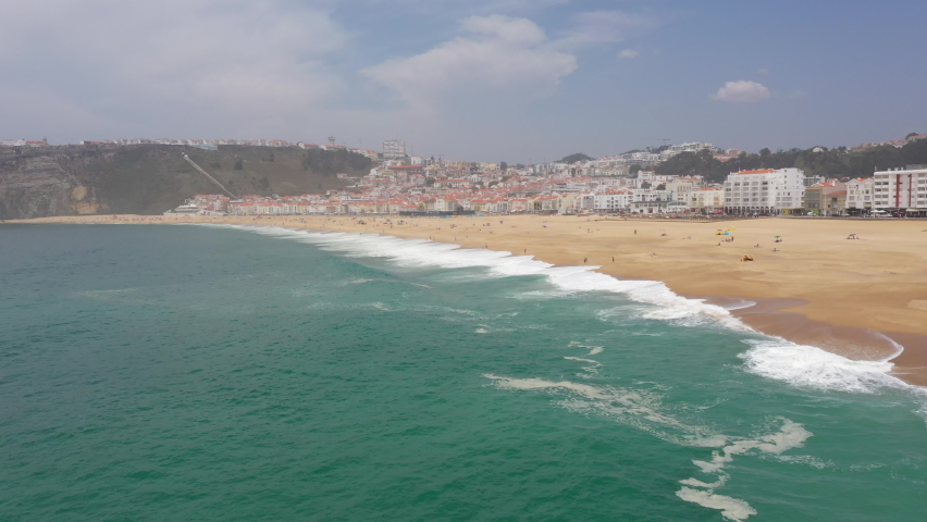 Aerial view of wide beaches of Nazare, as Portugal reopens borders and eases Covid-19 restrictions
 Royalty-Free Stock Footage #1078732835