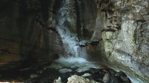 Scenic Cave Waterfall In Grotto Trollkirka, Norway - wide shot