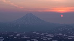 Sunrise with a view of the Vilyuchinsky volcano from the top of the Gorely volcano on the Kamchatka Peninsula in Russia. The ascent to this point took more than 4 hours.