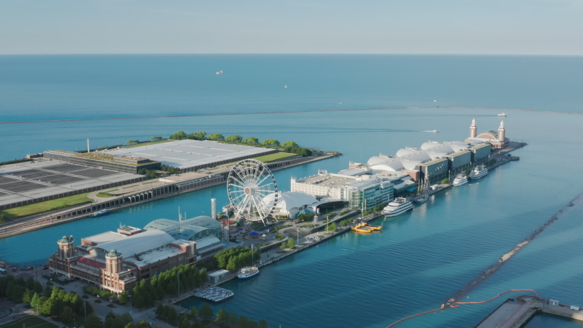 Chicago Navy Pier with clear calm blue Michigan lake on cinematic motion background. Copy space on blue horizon sky view background. Sunny summer day, 4K footage Chicago Illinois USA aerial footage Royalty-Free Stock Footage #1078739231