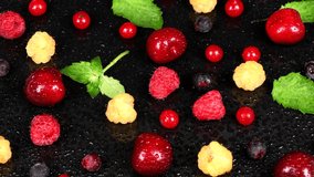 Many berries with water drops. Side view. Loop motion. Rotation 360. 4K UHD video footage 3840X2160