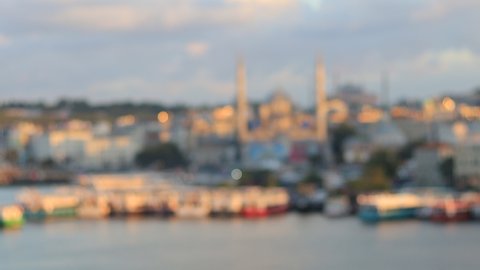Blur texture background for design. Out of focus view of the evening sea and ships sailing on the water. View of the Sea of ​​Marmara and the Bosphorus in Istanbul city on a sunset.