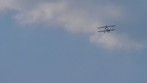 Ferrara Italy JUNE, 27, 2021 Beautiful small vintage biplane in flight in a blue summer sky. Christen Pitts S-2B Special