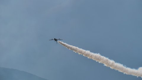 Maribor Airshow Slovenia AUGUST, 15, 2021 Skilled combat military pilot does a roll from back to back in an airshow. Frecce Tricolori Tricolour Arrows Italian Air Force Aerobatic Team Aermacchi MB-339