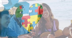 Animation of colourful puzzle pieces heart over happy friends drinking beer at summer beach party. autism, learning difficulties, support and awareness concept digitally generated video.