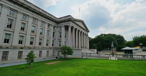 A daytime establishing shot of the U.S. Department of The Treasury building in Washington, D.C.