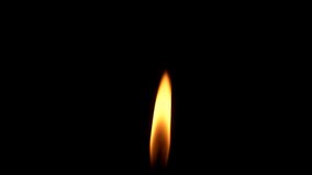 Closeup candle fire flame isolated burning on black background, slow motion HD