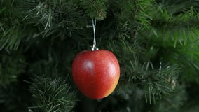 Vegan New Year. A Christmas fresh apple decoration on the tree in the room. - Powered by Shutterstock - Get 15% off with code: PIKWIZARD15
