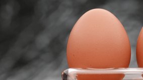 Video 4k and full HD of quality healthy organic egg with eggshell isolated on background.