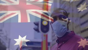 Animation of flag of australia waving over man wearing face mask during covid 19 pandemic. global covid 19 pandemic concept digitally generated video. - Powered by Shutterstock - Get 15% off with code: PIKWIZARD15