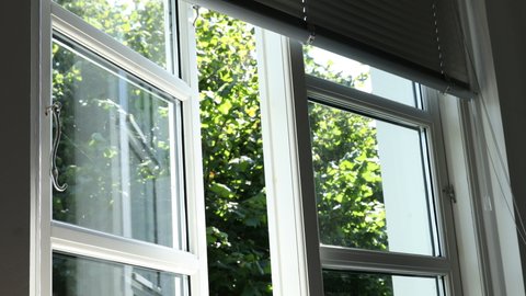Window in a Danish summerhouse on a summer day 