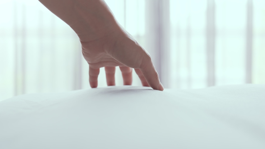 Close up hand of woman dragging on clean white bed gently with relax, Slow motion | Shutterstock HD Video #1078791515