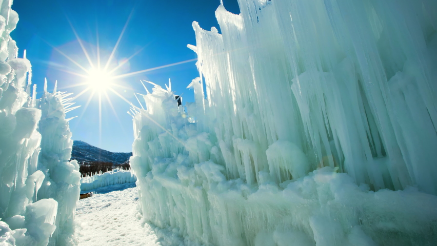 Panning Shot Of Beautiful White Ice Castles During Sunny Day - Midway, Utah Royalty-Free Stock Footage #1078800230