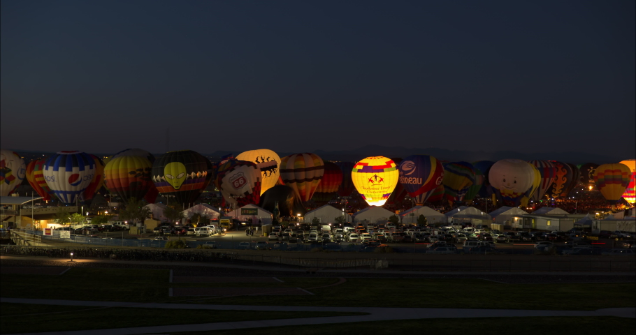 Time Lapse Lockdown Shot Of Hot Air Balloons Festival Against Clear Sky During Night - Albuquerque, New Mexico