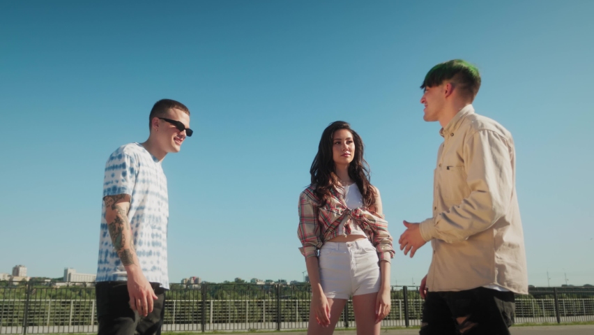Joyful Multicultural Teenagers Standing In Circle, Young people, man and woman, medical protection safety coronavirus covid 19 masks, Low Angle. Generation z millennials have fun on party in circle
