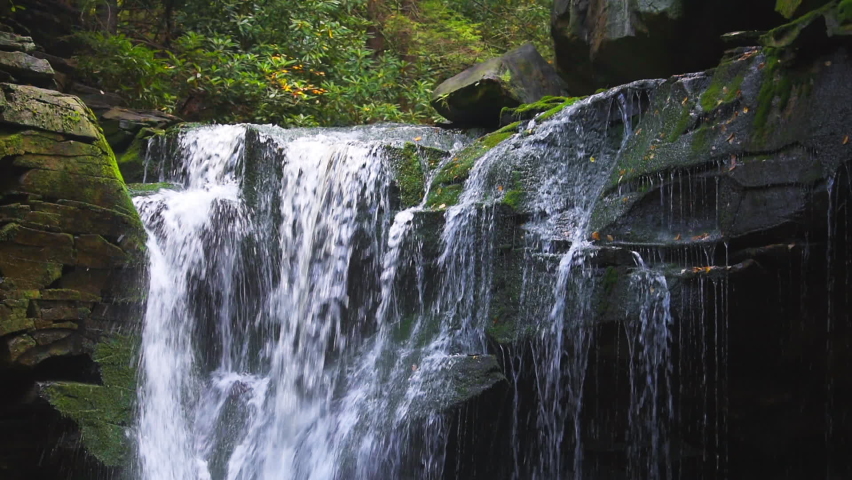 Blackwater Falls famous Elakala waterfall water flowing closeup in State Park in West Virginia during autumn fall season and rocks