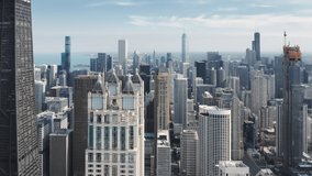 Cinematic glass concrete design business offices buildings in the center of Chicago city. Modern downtown Chicago architecture summer aerial. Contemporary urban cityscape view, drone b roll 4K footage
