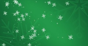 Animation of snowflakes falling on green background. christmas, tradition and celebration concept digitally generated video.