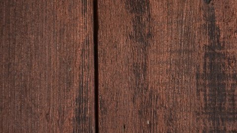 Closeup view 4k stock video footage of brown wooden texture of door or fence
