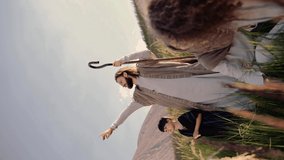 Jesus with stuff, children and Mary among the ears on the hill. Sun shining. They talk to each other and smiling. Vertical video. High quality 4k footage