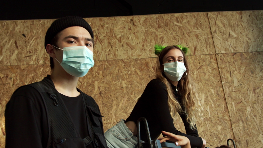 Young people wearing blue face masks during the COVID-19 pandemic