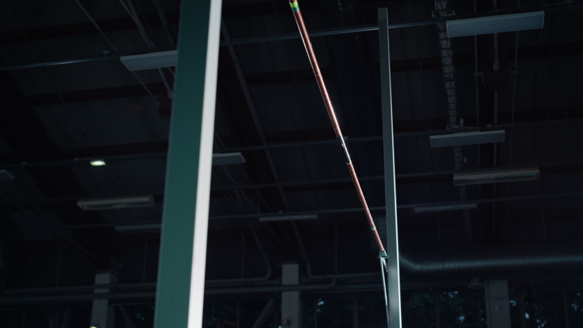 Pole Vault Jump: Professional Male Athlete Running with Pole Jumping but Hitting Bar. Motivation, Endevaor, Perseverance of Champion. Positive Person Training, Not Scared of Failure and Obstacles Royalty-Free Stock Footage #1078843475