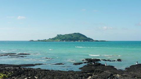 A view of the clear blue sea and the island. Jeju Island.