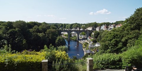 Knaresborouigh , Yorkshire , United Kingdom (UK) - 07 17 2021: Knaresborough Yorkhire England UK, wide shot showing river Nidd and railway viaduct