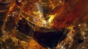 Super slow motion of pouring whiskey or rum with camera motion. Unique angle with underwater macro lens. Filmed on high speed cinema camera, 1000 fps. - Powered by Shutterstock - Get 15% off with code: PIKWIZARD15