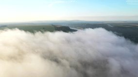Awesome top view of the misty morning rural scene, agricultural land. Cinematic aerial shot. Location place of Dniester river, Ukraine, Europe. Discover the beauty of earth. Filmed in 4k, Drone video.