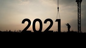 Time lapse engineer changes 2022 sign in celebration of the new year. Crane construction idea. - Powered by Shutterstock - Get 15% off with code: PIKWIZARD15