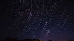 star trails in the night sky - Powered by Shutterstock - Get 15% off with code: PIKWIZARD15