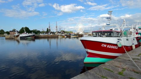 Honfleur, France - July 28, 2021: Fishing boat in the port of Honfleur, a french commune in the Calvados department and famous tourist resort in Normandy.