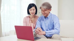 Asian senior couple using a laptop PC. - Powered by Shutterstock - Get 15% off with code: PIKWIZARD15
