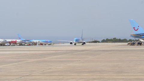 Ibiza , Spain - 07 21 2021: TUI Aircraft Taxiing At The Apron Of Ibiza Airport, Spain Before Parking