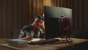 Bored Asian Boy Student Distance Learning, Learn Online On Computer From Home
