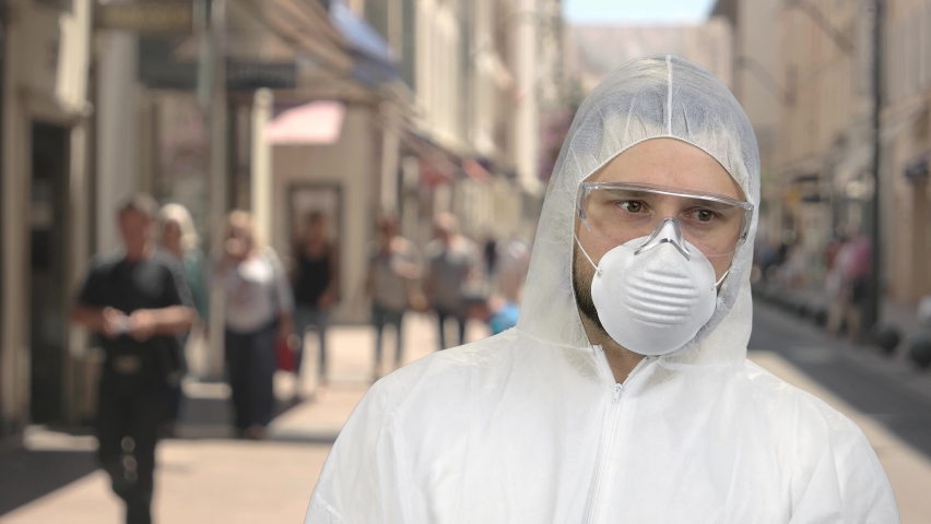 Portrait of a man in protective clothing standing downtown.