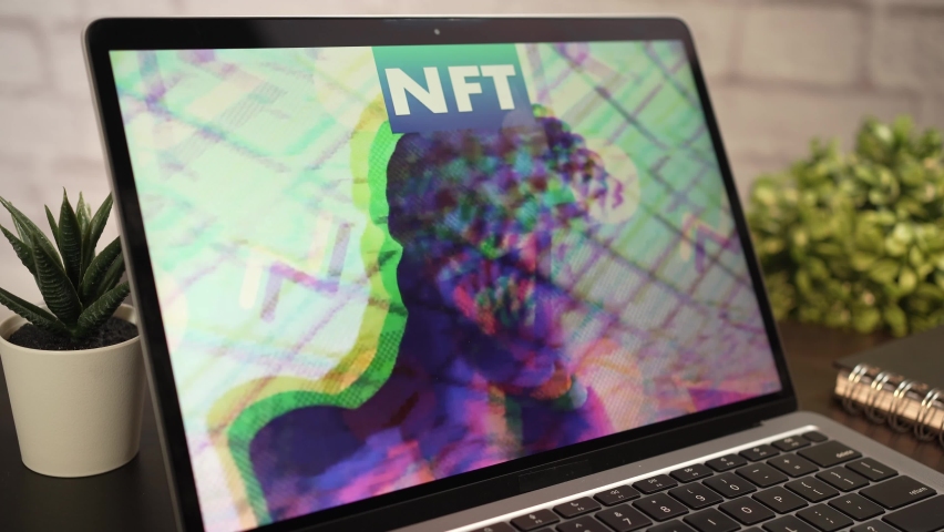On a laptop computer screen an animated NFT Non-fungible token on display Royalty-Free Stock Footage #1078918262