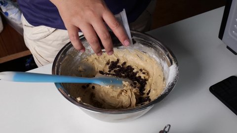 Add chocolate chips and mix to make slow motion cookies.