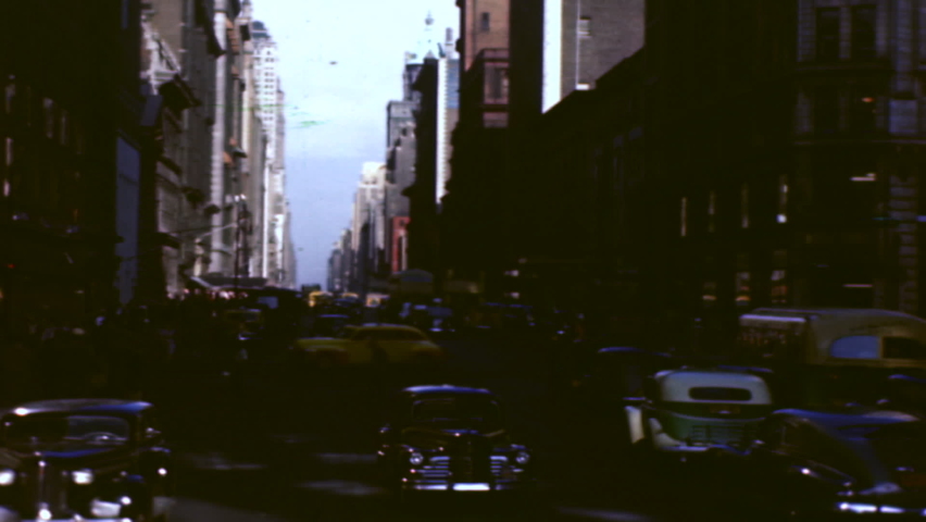 New York City, NY, USA - CIRCA 1946: NYC Downtown Manhattan Street Scene Vintage Cars Daytime