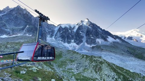 Chamonix-Mont-Blanc - France, August 31, 2021: Aiguille du Midi car arriving from 3777m to 2317m. This cable way famous as the highest vertical ascent cable car in the world at Plan de l'Aiguille.