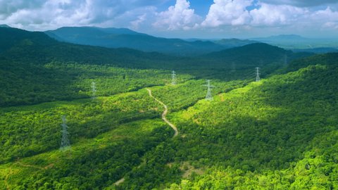 Hyperlapse by drone The view is beautiful in the morning during over the mountains. On the mountain there is a large line of power transmission towers, Pang Pue Mae Moh, Lampang, Thailand.