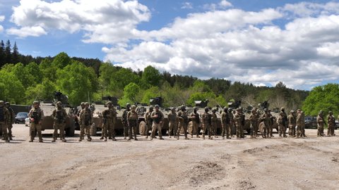 Pocek Military Training Area Slovenia MAY, 20, 2021 Military training demonstrations as part of Exercise Defender Europe 2021. Slovenian soldiers in front of tanks
