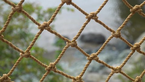 Rope Net Barrier On Seashore Of Beach Resort At Daytime. - zoom out