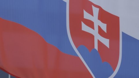 Ungraded: National flag of Slovakia on the flagpole. Slovak official flag waving in the wind. Ungraded H.264 from camera without re-encoding.